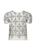 The SUIT by me ISSEY MIYAKE is a short-sleeved white mesh top with gray and blue floral patterns accented by subtle playing card motifs, shown against a plain white background.