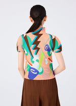 A woman with long dark hair tied back is shown from behind against a plain light background, wearing the SURPRISE BOX short-sleeved, high-neck top by me ISSEY MIYAKE with a colorful jack-in-the-box pattern and a pleated brown skirt.
