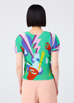 A person with a short, straight black bob is seen from behind wearing me ISSEY MIYAKE’s SURPRISE BOX: a colorful round-neck, short-sleeve top with abstract patterns and light pink pleated pants. The background is plain and light.
