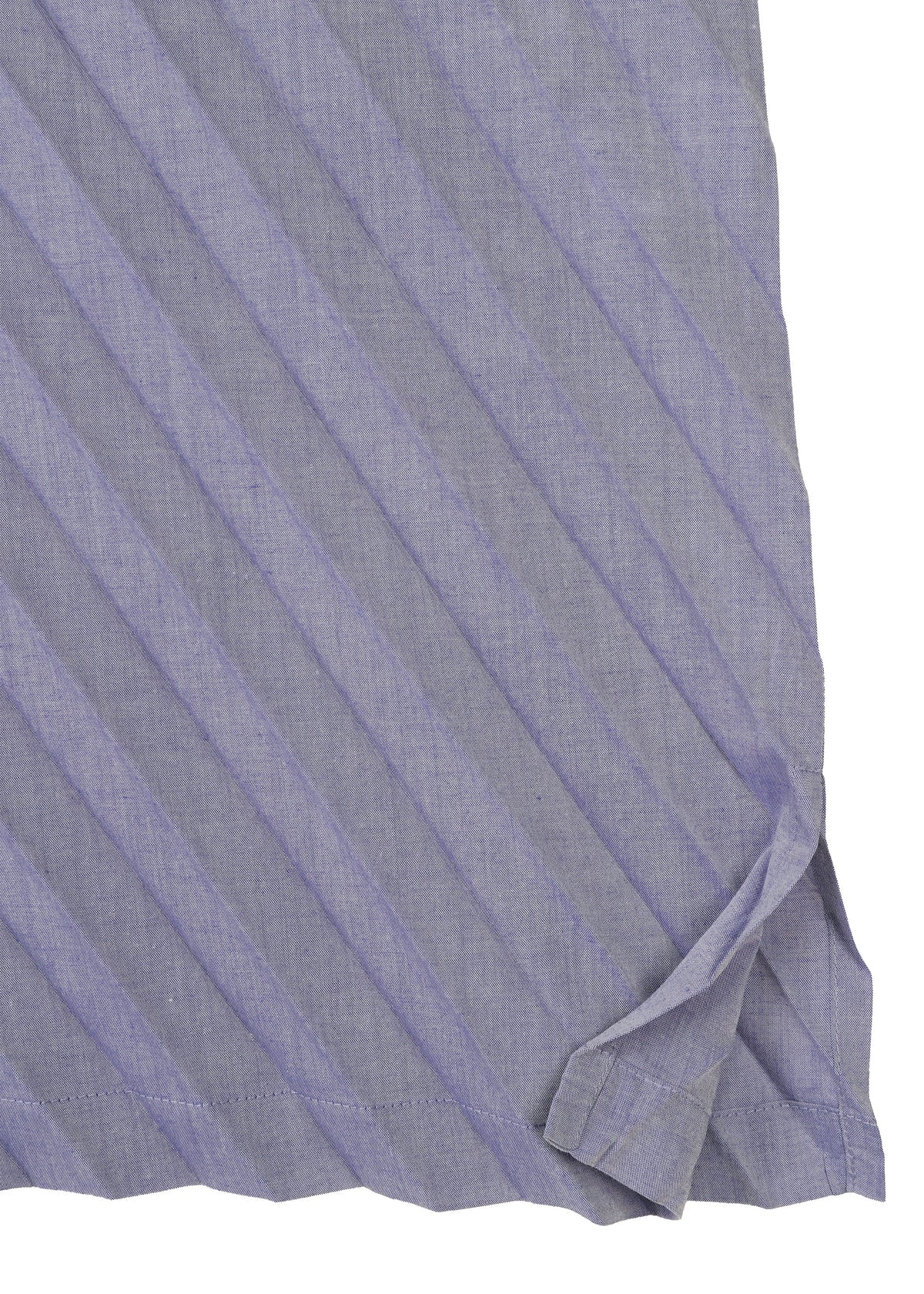 A close-up of the ANGLE PLEATS SHIRT by me ISSEY MIYAKE in light purple, featuring diagonal stripes and a folded hemmed corner that highlights its melange finish. view 5 of 9