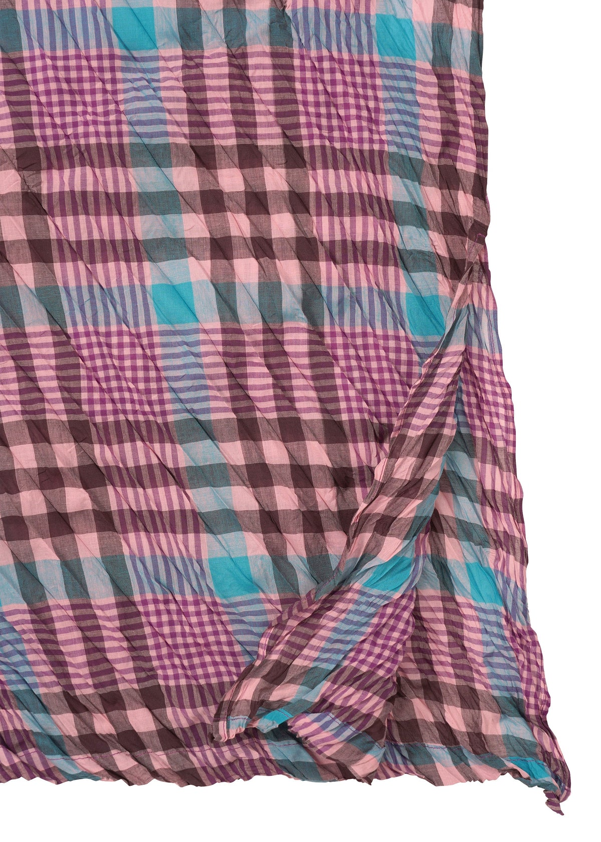 A close-up of the me ISSEY MIYAKE CHECK WHIPPED PLEATS SHIRT—a lightweight women’s tunic with a pink, purple, blue, and brown plaid pattern. The sheer summer fabric has slightly curled and wrinkled edges. view 4 of 7