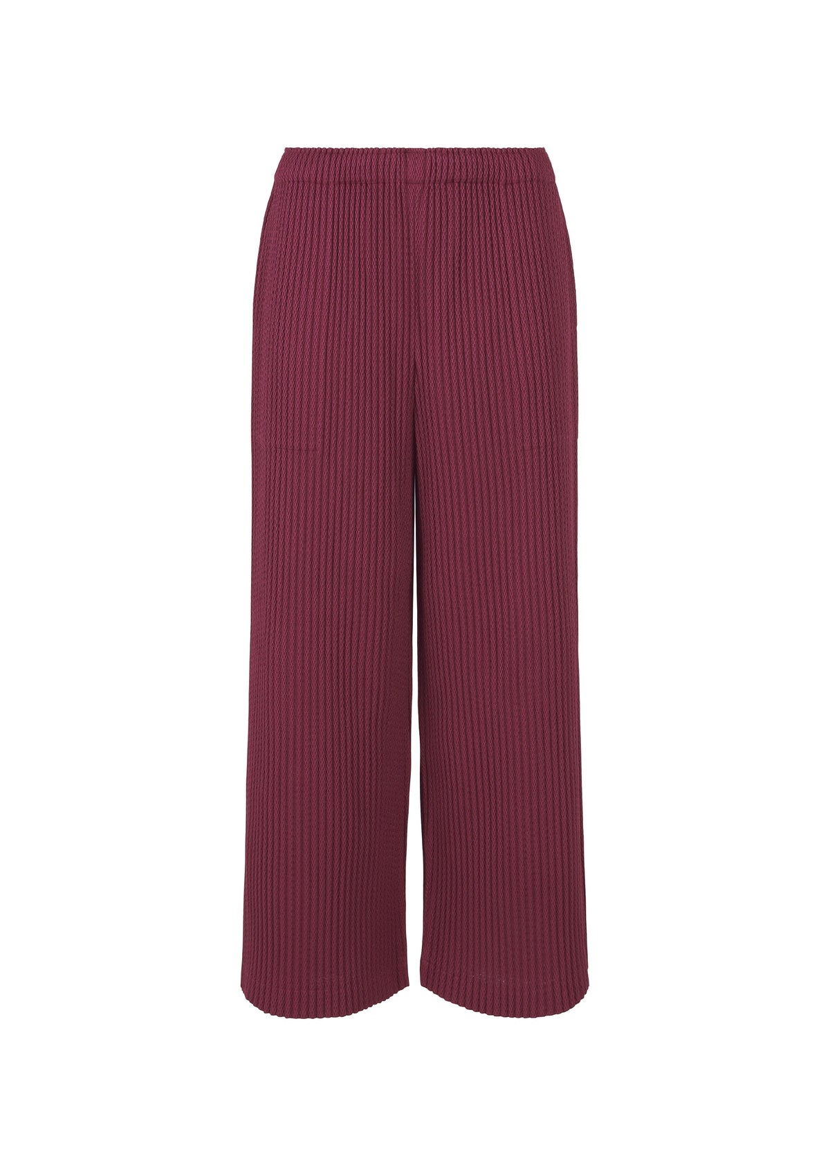 The WARM MESH PLEATS pants by me ISSEY MIYAKE feature a wide-leg, relaxed fit in deep burgundy with an elastic waistband and vertical ribbing. Subtle pleats add texture. Shown against a white background. view 2 of 6