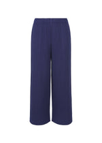 The WARM MESH PLEATS wide-leg, high-waisted navy pants by me ISSEY MIYAKE feature ribbed knit fabric, pleated detailing, and an elastic waistband, shown against a white background. - COBALT BLUE （no.74）