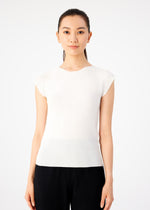 A woman with long dark hair tied back wears the me ISSEY MIYAKE KNIT STRETCH PLEATS white round-neck top with French sleeves and black pants, standing against a plain white background and looking at the camera.