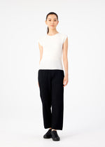 A person stands facing forward against a white background, wearing a me ISSEY MIYAKE KNIT STRETCH PLEATS black wide-leg pant, a white round neck top with French sleeves, and black shoes.