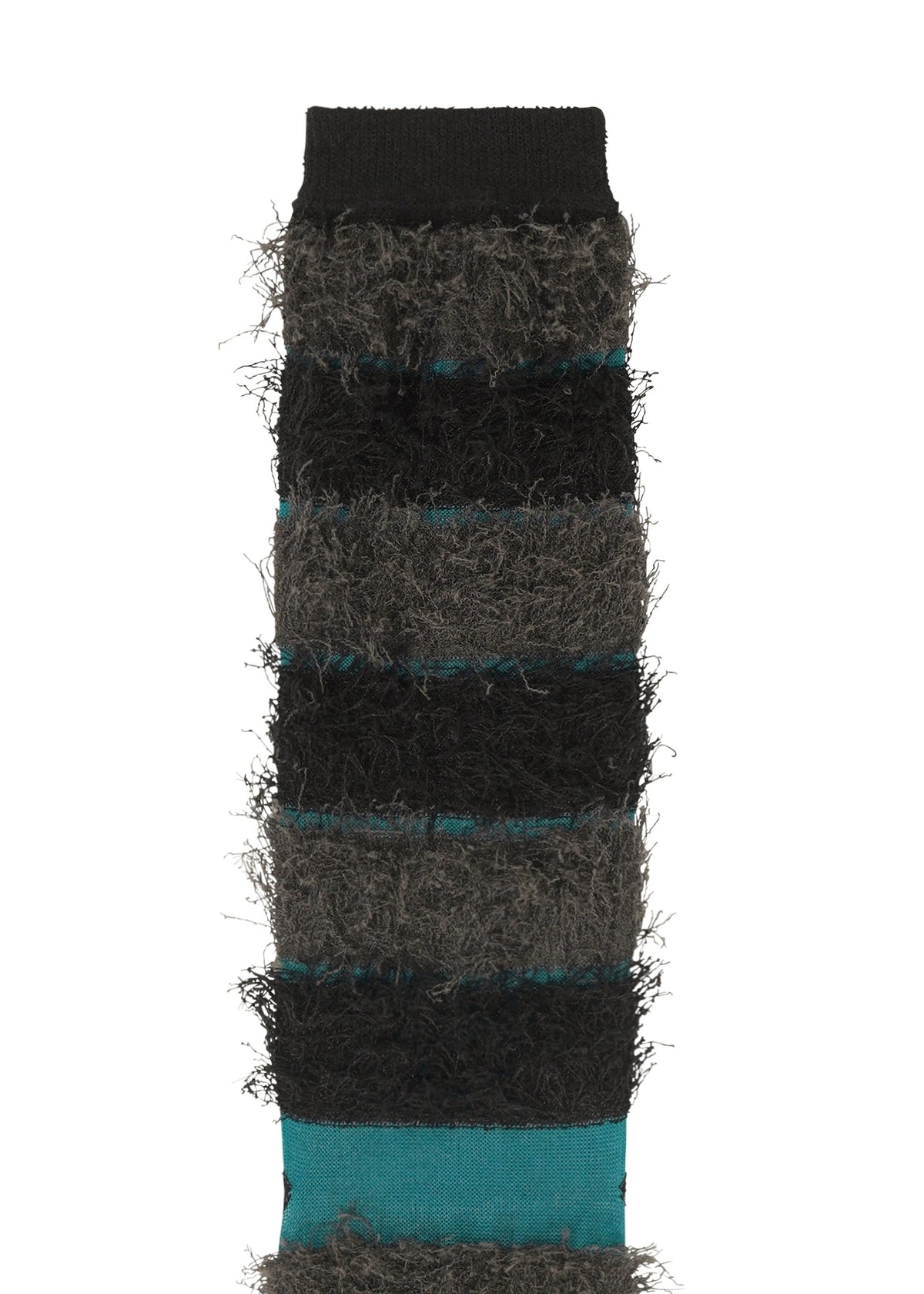The TAIL SOCKS by me ISSEY MIYAKE feature fuzzy, fluffy texture with black, dark gray, and teal horizontal stripes. Soft and cozy with a shaggy fringe look, these socks are shown upright with the top cuff visible. view 5 of 7