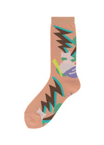 The SURPRISE BOX SOCKS by me ISSEY MIYAKE is a single peach novelty sock with bold black, green, blue, white, and purple abstract patterns—creating a playful geometric look ideal for patterned sock fans. - PEACH-HUED （no.38）