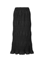 The SHRINK STRIPE by me ISSEY MIYAKE is a long black cotton-blend skirt with a smocked elastic waistband, horizontal ruching, and a slightly ruffled hem. The skirt has a textured, flowy look against a plain white background. - BLACK (no.15)