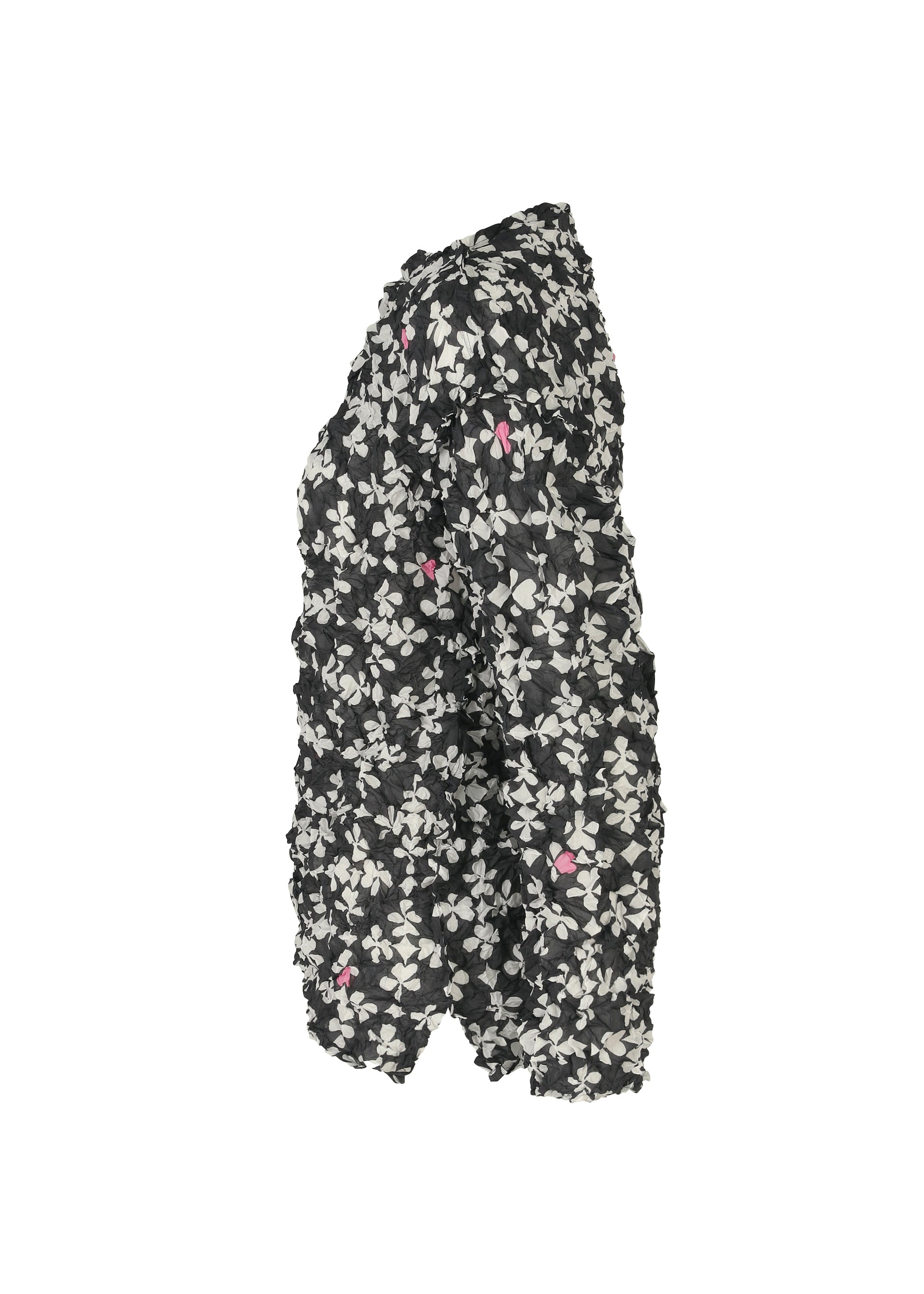 Zoomed view Side view of the SUIT MERINGUE TOP by me ISSEY MIYAKE—a textured black jacket with a white and pink floral pattern and a puffy, crushed pleat look—shown against a white background.