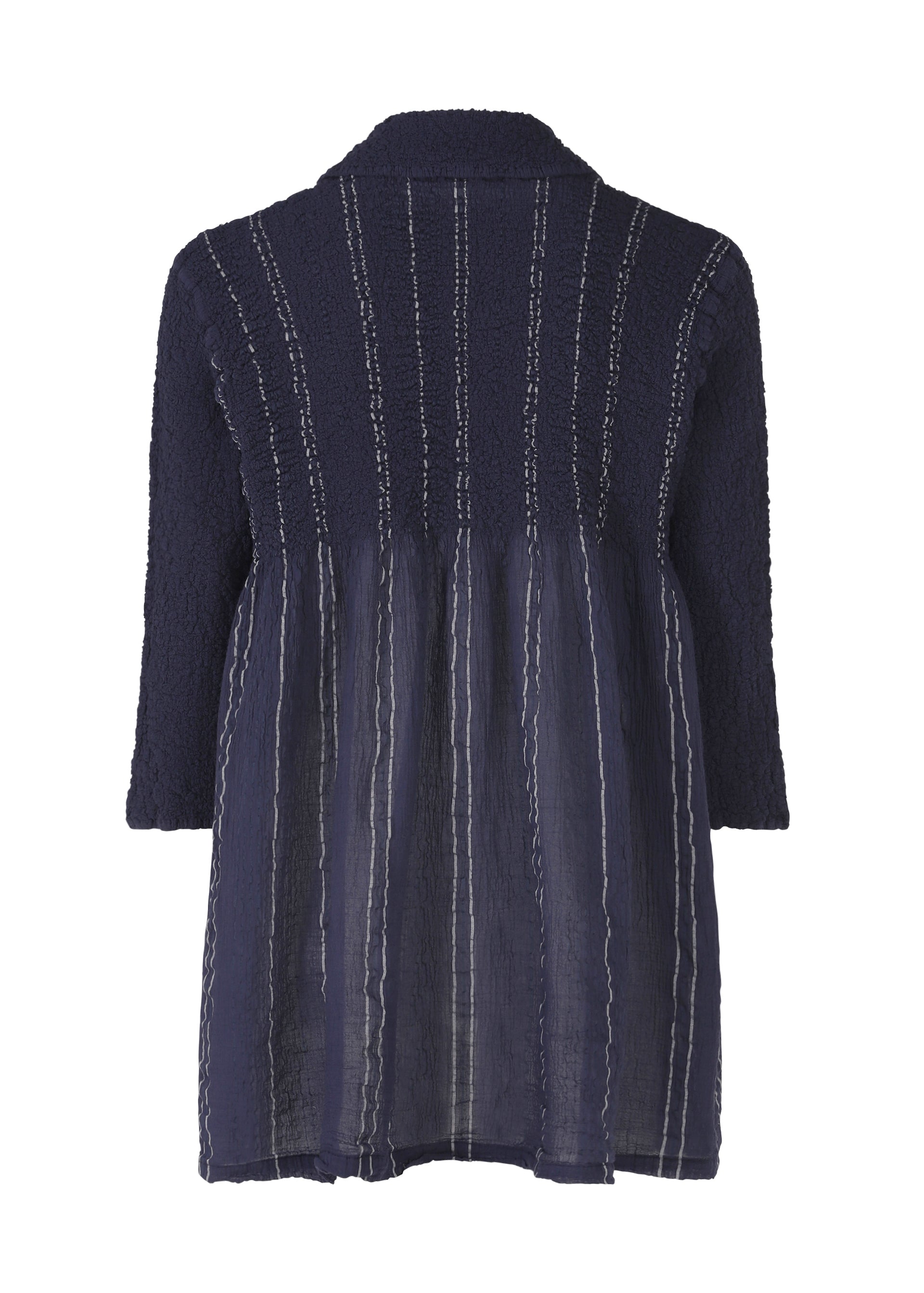 Zoomed view The SHIRT STRIPE CAULIFLOWER by me ISSEY MIYAKE is a navy cotton blouse with a loose fit, subtle collar, textured upper back, and vertical stripes on the lower half. Shown from the back.