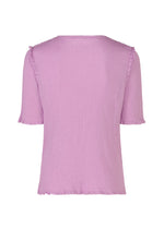 Back view of the me ISSEY MIYAKE SEE-THROUGH CREPE COLOR top—round neck, short sleeves, light purple garment-dyed fabric with subtle ruffle trim on sleeves and hem—displayed against a plain white background.