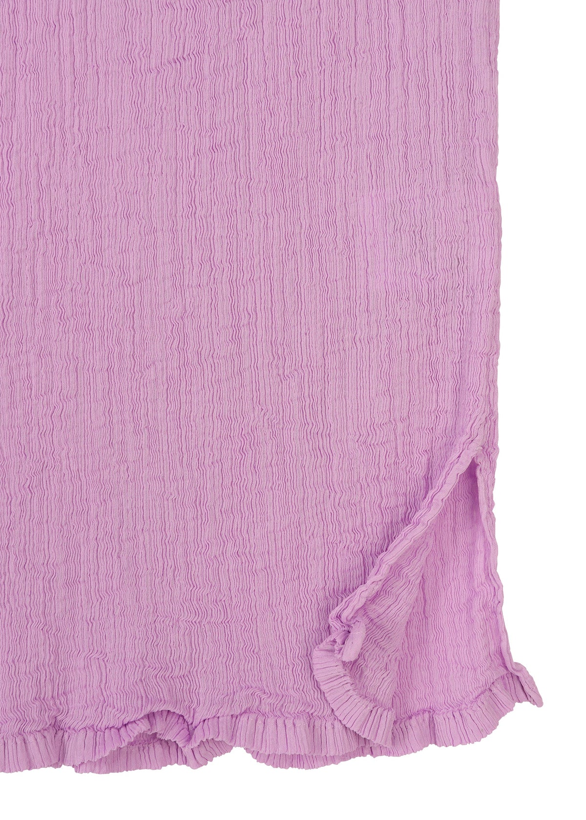 Close-up of the SEE-THROUGH CREPE COLOR top by me ISSEY MIYAKE in textured light purple, featuring garment-dyed crinkled fabric, a round neck, short sleeves, a ruffled hem, and a small side slit for added tactile appeal. view 5 of 8