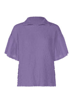 The SHEER CAULIFLOWER by me ISSEY MIYAKE is a lavender short-sleeve blouse with a textured finish, flared sleeves, and a small collar. Made of cotton for comfort, it features a relaxed fit and is shown on a white background. - VIOLET （no.82）