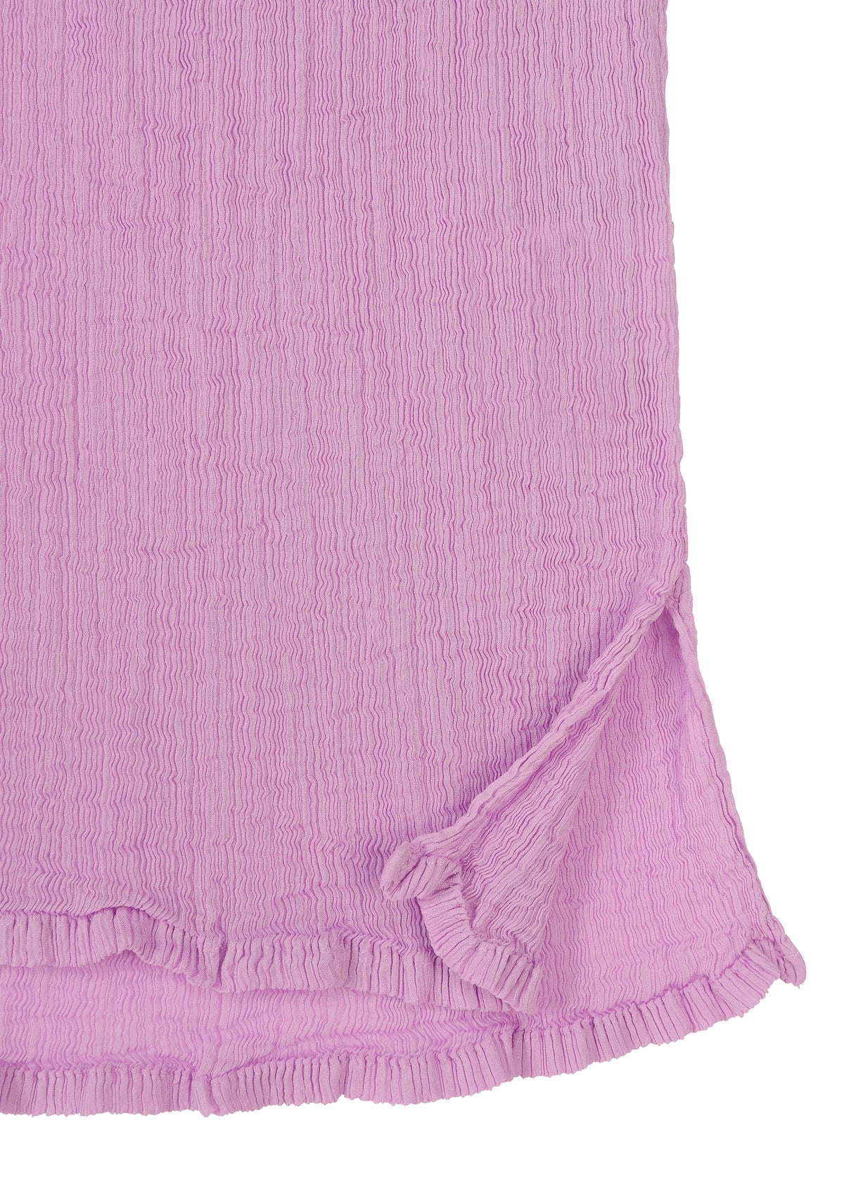 A close-up of SEE-THROUGH CREPE COLOR by me ISSEY MIYAKE, featuring textured light purple crepe fabric with a small side slit, frilled hem, and wavy, crinkled patterns. view 5 of 9