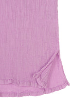 A close-up of SEE-THROUGH CREPE COLOR by me ISSEY MIYAKE, featuring textured light purple crepe fabric with a small side slit, frilled hem, and wavy, crinkled patterns.