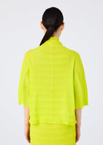 A person with long dark hair in a low ponytail is seen from behind, wearing the me ISSEY MIYAKE RIPPLE SEE-THROUGH CREPE top and matching skirt in bright yellow against a plain white background.
