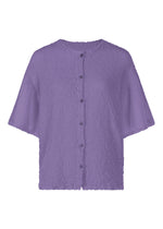 The SHEER CAULIFLOWER blouse by me ISSEY MIYAKE is a loose-fitting, textured lavender top with short sleeves, a round neck, and button-down front, inspired by the comfort of a cotton cardigan. - VIOLET （no.82）