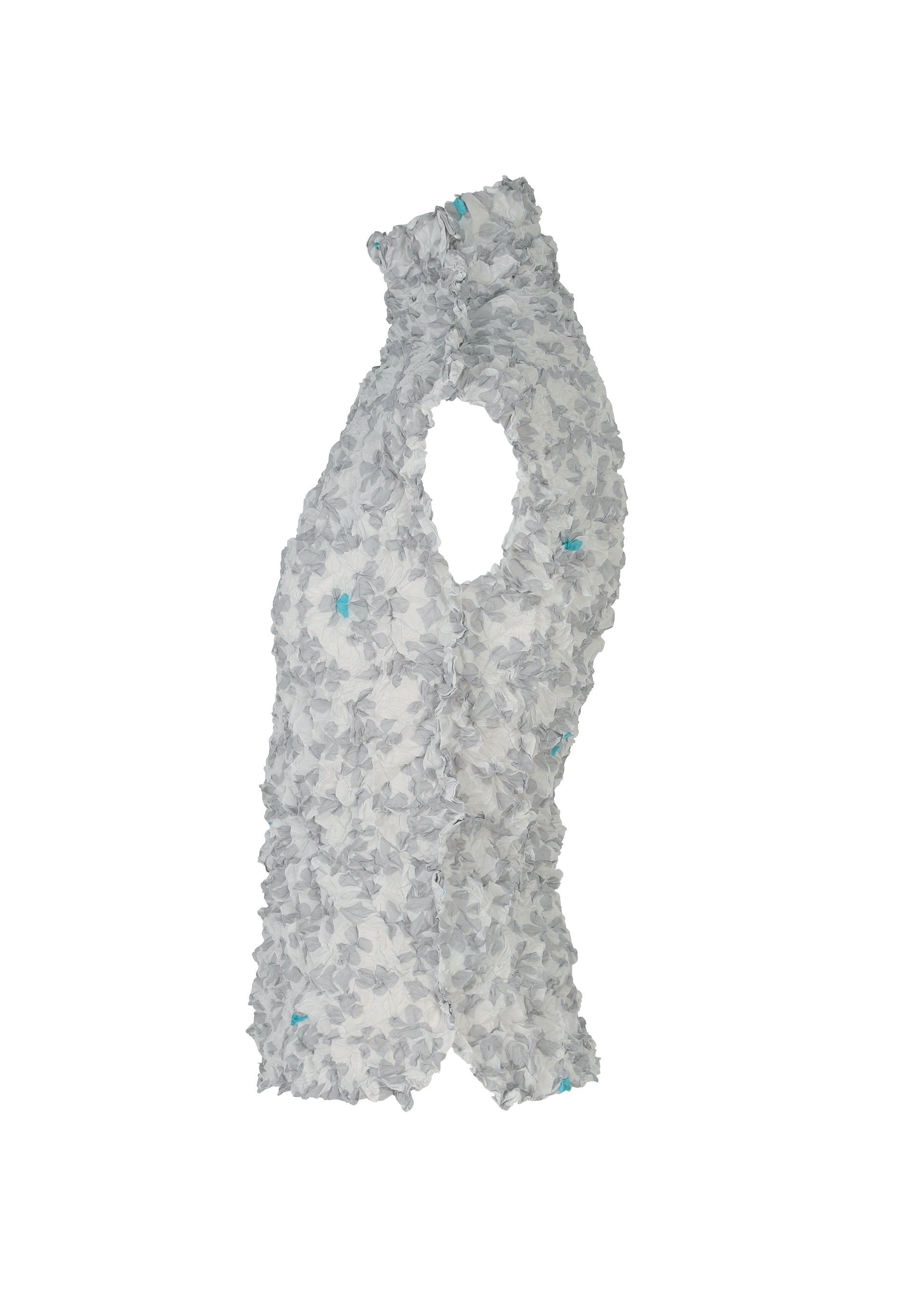 Zoomed view The SUIT MERINGUE TOP by me ISSEY MIYAKE, shown in light gray with a crushed pleat finish and subtle blue floral accents, is displayed in soft ruffles against a white background.