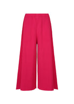 The FLARE PLEATS by me ISSEY MIYAKE are bright pink, wide-leg pants with fine knit pleats and a high-waisted, flared silhouette. They feature a relaxed fit and ankle-length hem, displayed against a plain white background. - RASPBERRY （no.23）