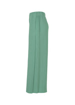 The FINE KNIT PLEATS BOTTOM 1 by me ISSEY MIYAKE is a long, high-waisted mint green skirt with fine knit pleats and an elastic waistband, shown side view on a white background.