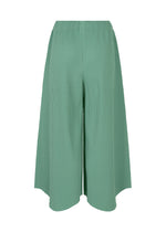 The "FINE KNIT PLEATS BOTTOM 1" by me ISSEY MIYAKE features wide-leg, high-waisted culotte pants in light sage green with a draped, finely pleated silhouette, shown against a white background.