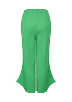 The FINE KNIT PLEATS BOTTOM 2 by me ISSEY MIYAKE features bright green stretchy knit, a high waist, wide flared legs, and scalloped hems. Shown from the back against a white background.