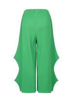The me ISSEY MIYAKE FINE KNIT PLEATS BOTTOM 2 features wide bright green pants with a ribbed texture and bold curved cutouts along the outer sides, displayed against a white backdrop.