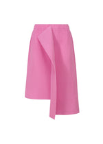 The TRICK PLEATS skirt by me ISSEY MIYAKE is a pink, knee-length, lightweight pleated skirt with vertical pinstripes and an asymmetric front drape, creating a 3D silhouette. Shown on a plain white background. - ROSE PINK （no.21）