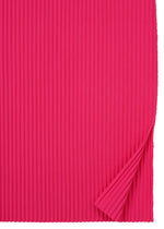 A sheet of FINE KNIT PLEATS COLOR 1 by me ISSEY MIYAKE in bright pink, with vertical ribbing like a pleated dress and a small lower right corner folded up to reveal matching texture beneath.