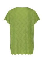 The WAVE KNIT STRETCH PLEATS by me ISSEY MIYAKE is a green, short-sleeved top with subtle wave-like textures and a loose, straight cut, shown from the back.