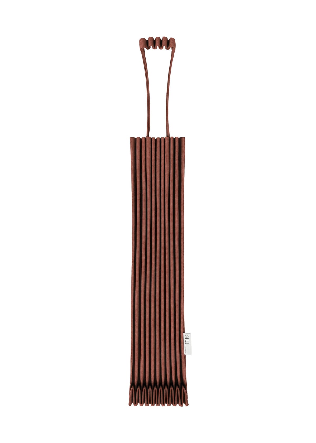 A pleated, dark brown TRUNK PLEATS BAG 12 by me ISSEY MIYAKE featuring a distinctive top handle and a small white label on the side, displayed against a white background. view 12 of 14
