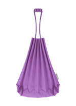 A vivid color accessory from me ISSEY MIYAKE, the TRUNK PLEATS BAG 12 is a purple mini tote showcasing elegant pleating, two looped handles, and a small white tag on the right side.