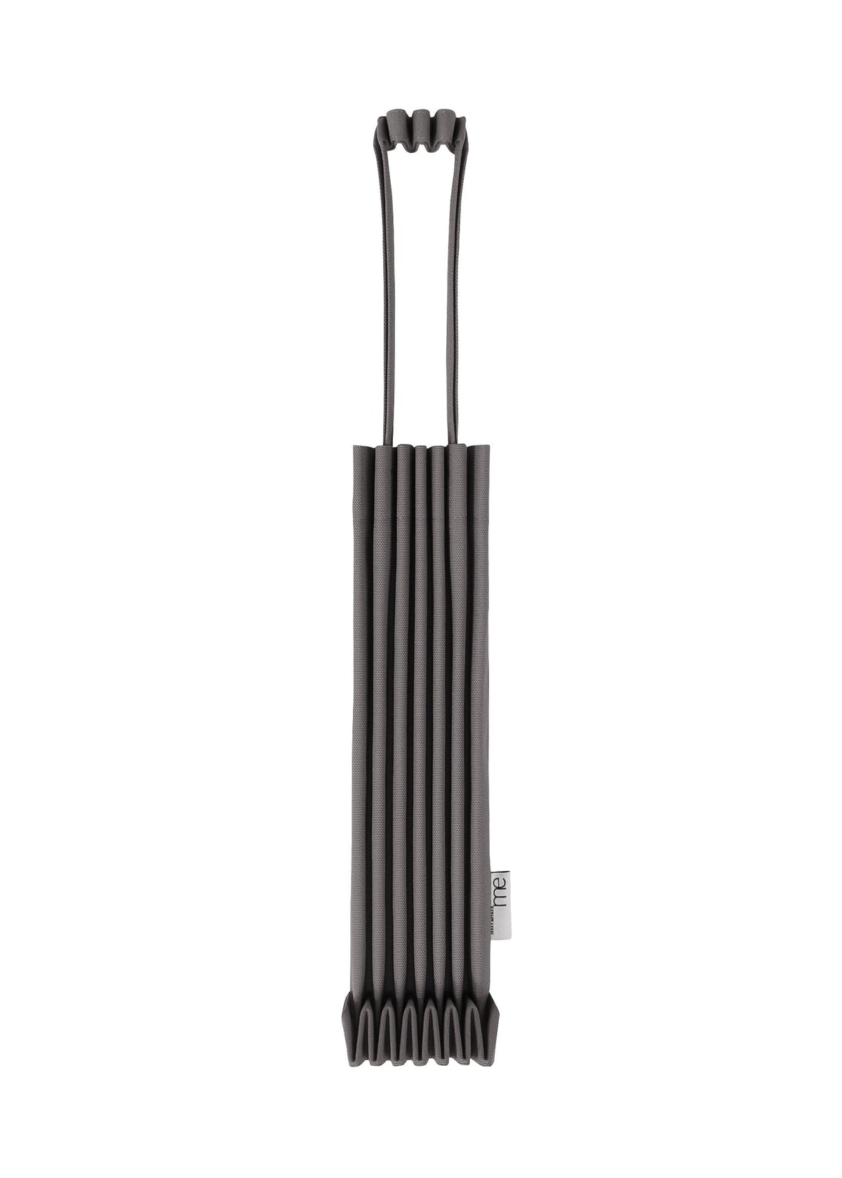 The TRUNK PLEATS BAG 12 by me ISSEY MIYAKE, a black accordion-style mini tote with two looped handles and a small white side tag, is showcased strikingly against a white background. view 2 of 14