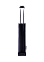 The TRUNK PLEATS BAG 12 by me ISSEY MIYAKE is a dark blue mini tote featuring vertical pleats, two top handles, and a small white side tag, its striking color highlighted against a white background. - NAVY （no.75）