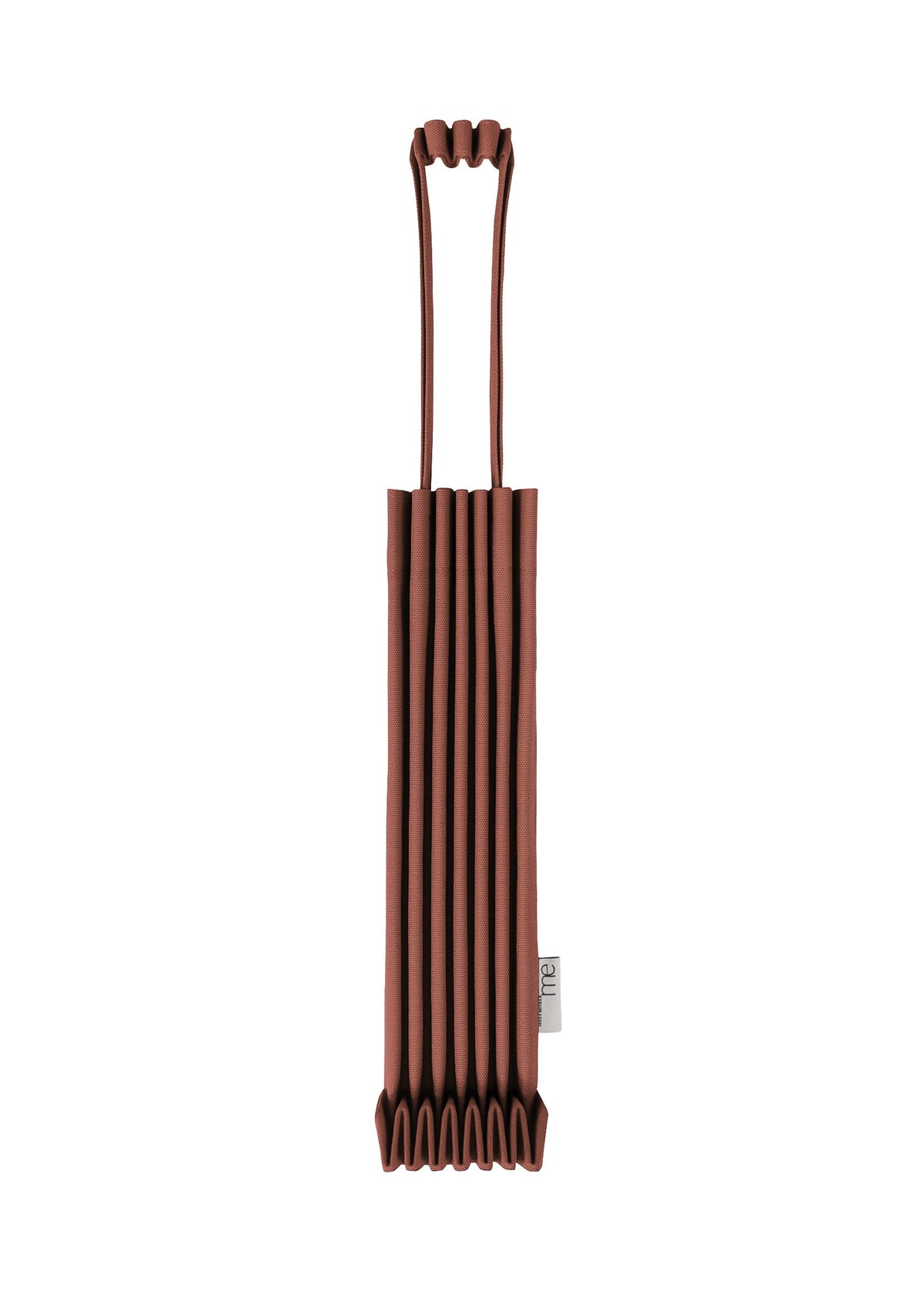 A brown TRUNK PLEATS BAG 12 by me ISSEY MIYAKE, made from pleated fabric in a mini tote silhouette with long handles, is shown upright against a white background. This stylish bag features distinctive pleats and a small tag with text sewn near the bottom on one side. view 8 of 14