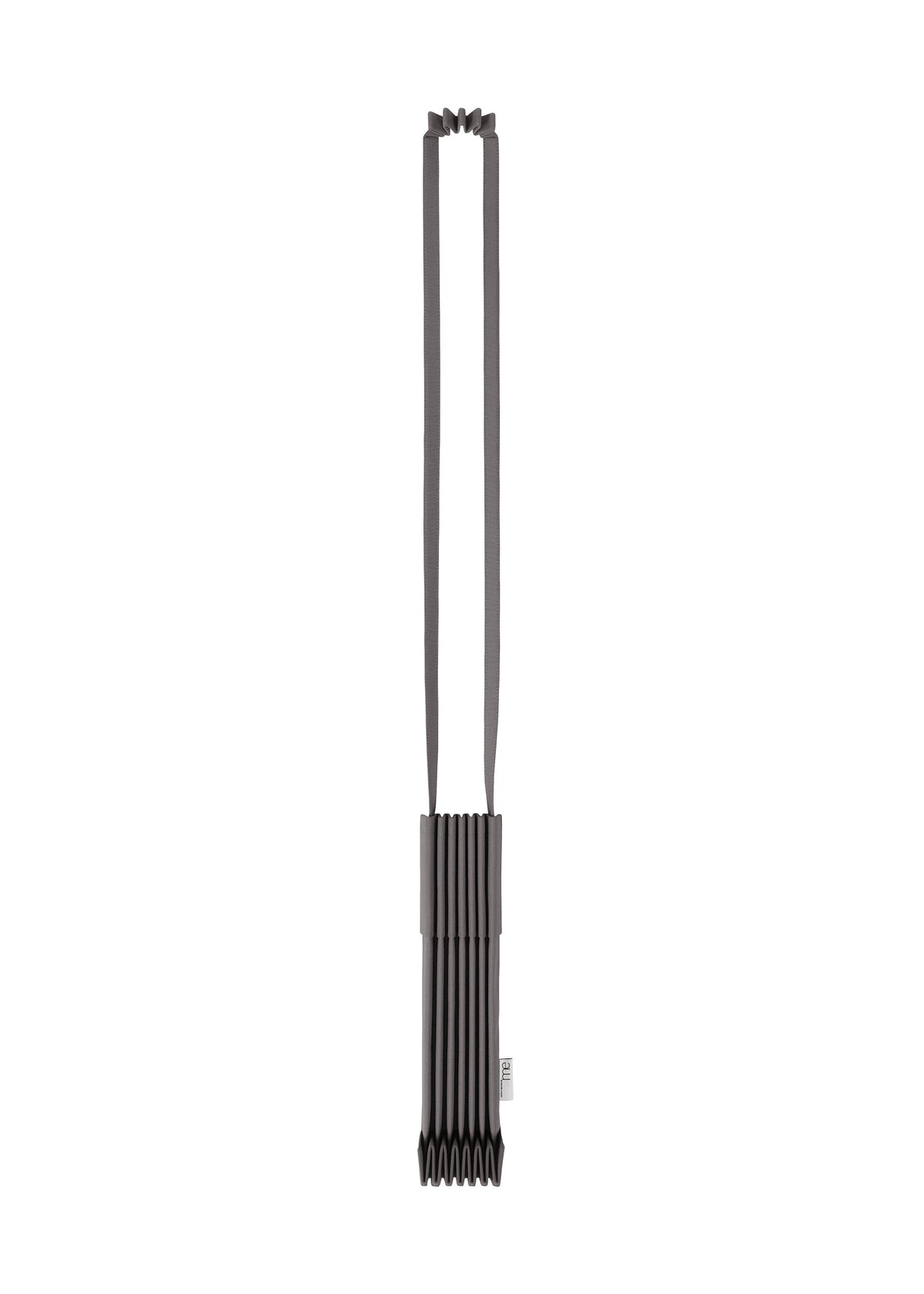 The TRUNK PLEATS BAG 12 by me ISSEY MIYAKE is a modern, minimalist black bag featuring a pleated design and long, flat straps, displayed against a white background. view 2 of 16