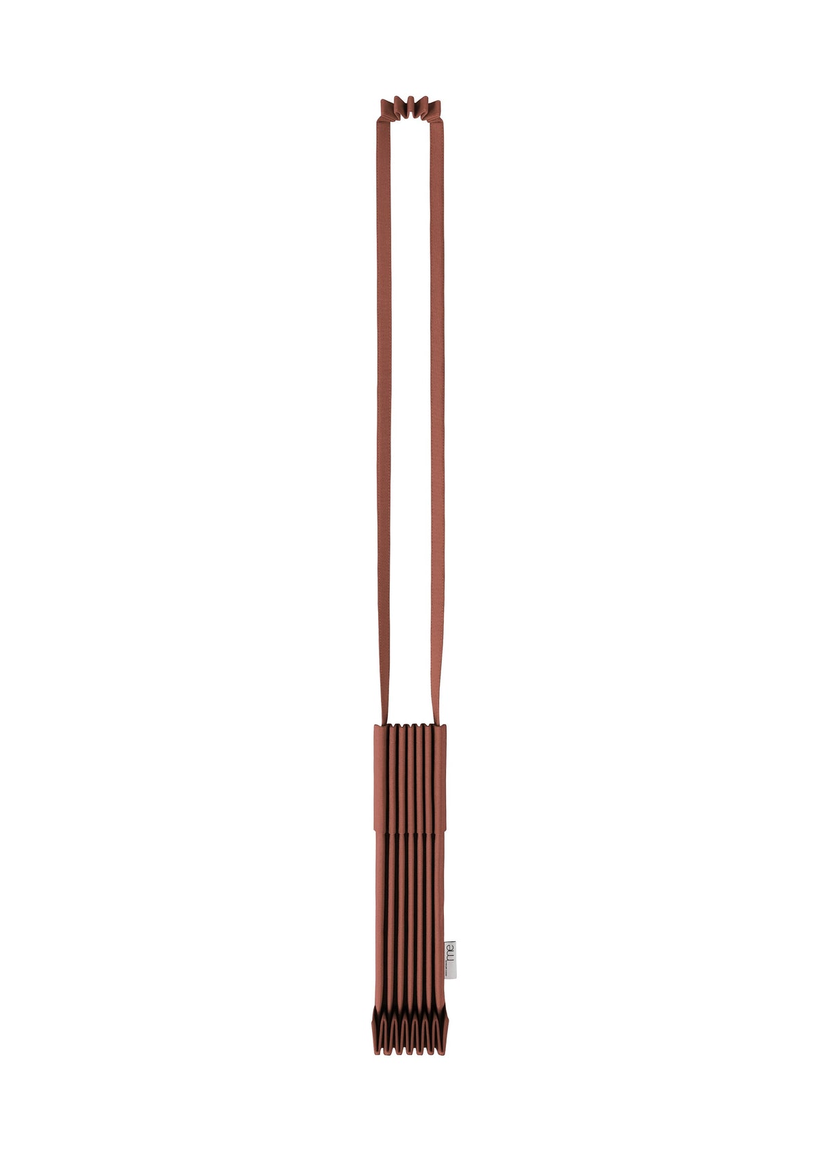 The TRUNK PLEATS BAG 12 by me ISSEY MIYAKE is a brown, rectangular shoulder bag with accordion-style pleats and a long strap, displayed against a white background. Its compact size and unique structured design make it stand out even in understated tones. view 8 of 16