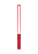 The TRUNK PLEATS BAG 12 by me ISSEY MIYAKE is a red pleated shoulder bag with a long, flat strap and an accordion-style body, displayed against a white background.