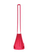 The TRUNK PLEATS BAG 12 by me ISSEY MIYAKE is crafted from bright pink pleated fabric and comes with a long, matching strap. This bold shoulder bag showcases a unique geometric, fan-like silhouette and features a small side tag. The bag is displayed against a plain white background.