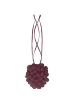 The FRUITS POUCH by me ISSEY MIYAKE is a small, round, deep burgundy bag with petal-like fabric details and long, thin shoulder straps, shown against a white background. - DRAGON FRUITS （no.95）