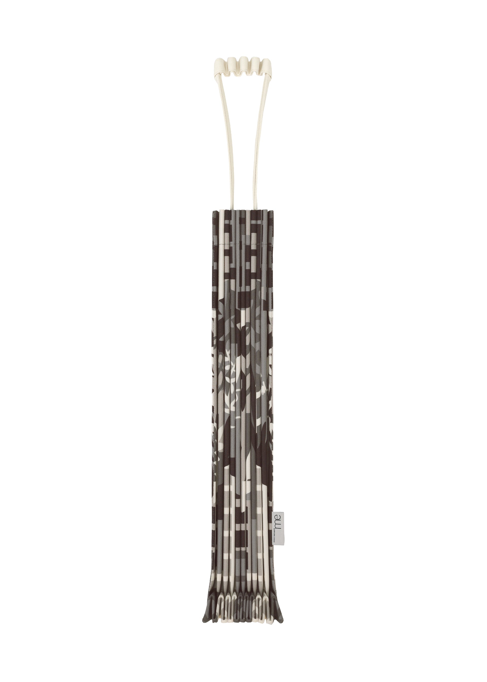 Zoomed view A vertically standing BUILDING TRUNK PLEATS BAG by me ISSEY MIYAKE, featuring a distinctive brown and beige patterned design, neatly wrapped in its matching cover with the same printed motif, set against a white background. - GRAY-HUED （no.17）