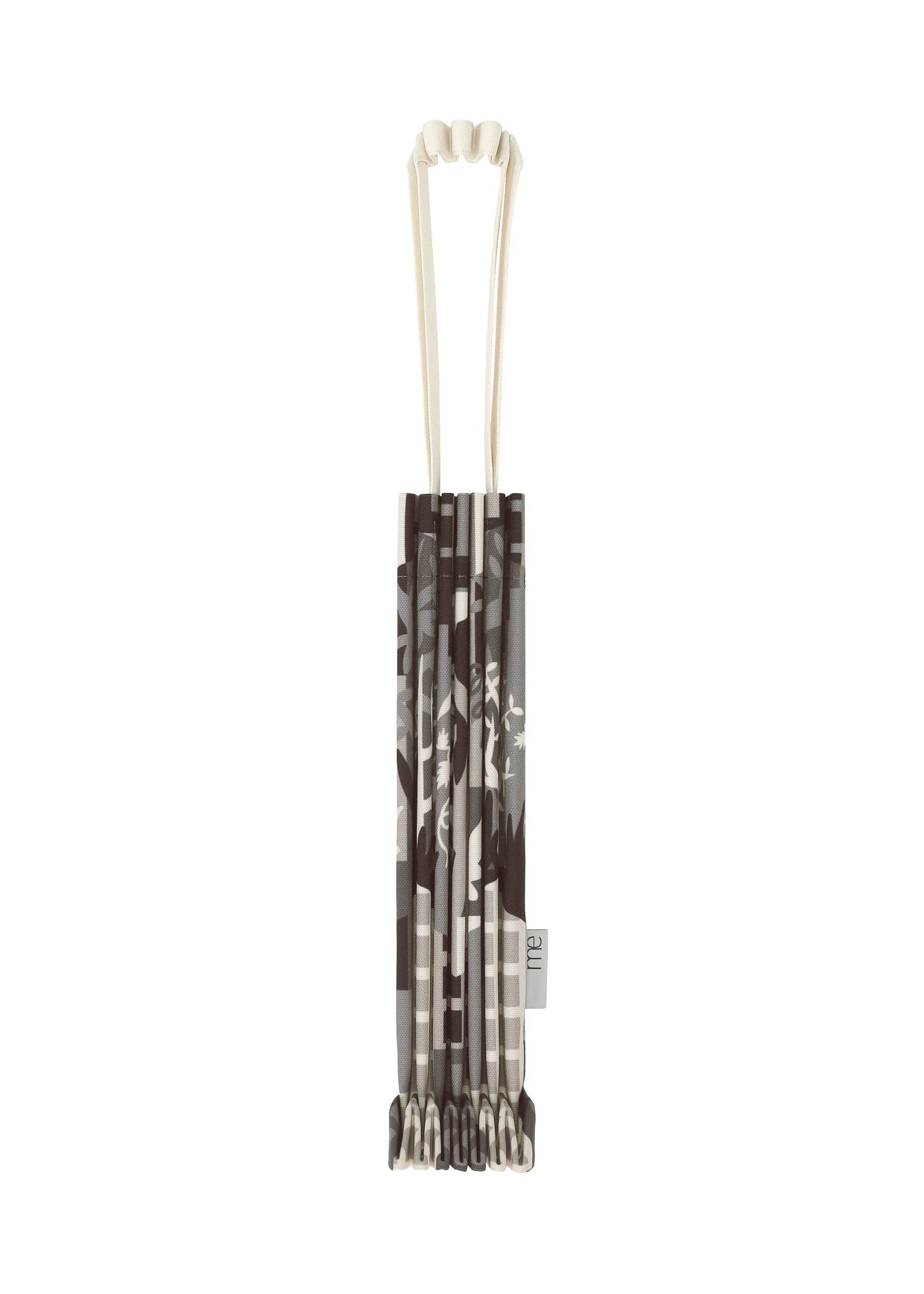 Zoomed view BUILDING TRUNK PLEATS BAG by me ISSEY MIYAKE in folded gray and white patterned design, featuring a unique handle and a white strap, displayed from above against a white background. - GRAY-HUED （no.17）
