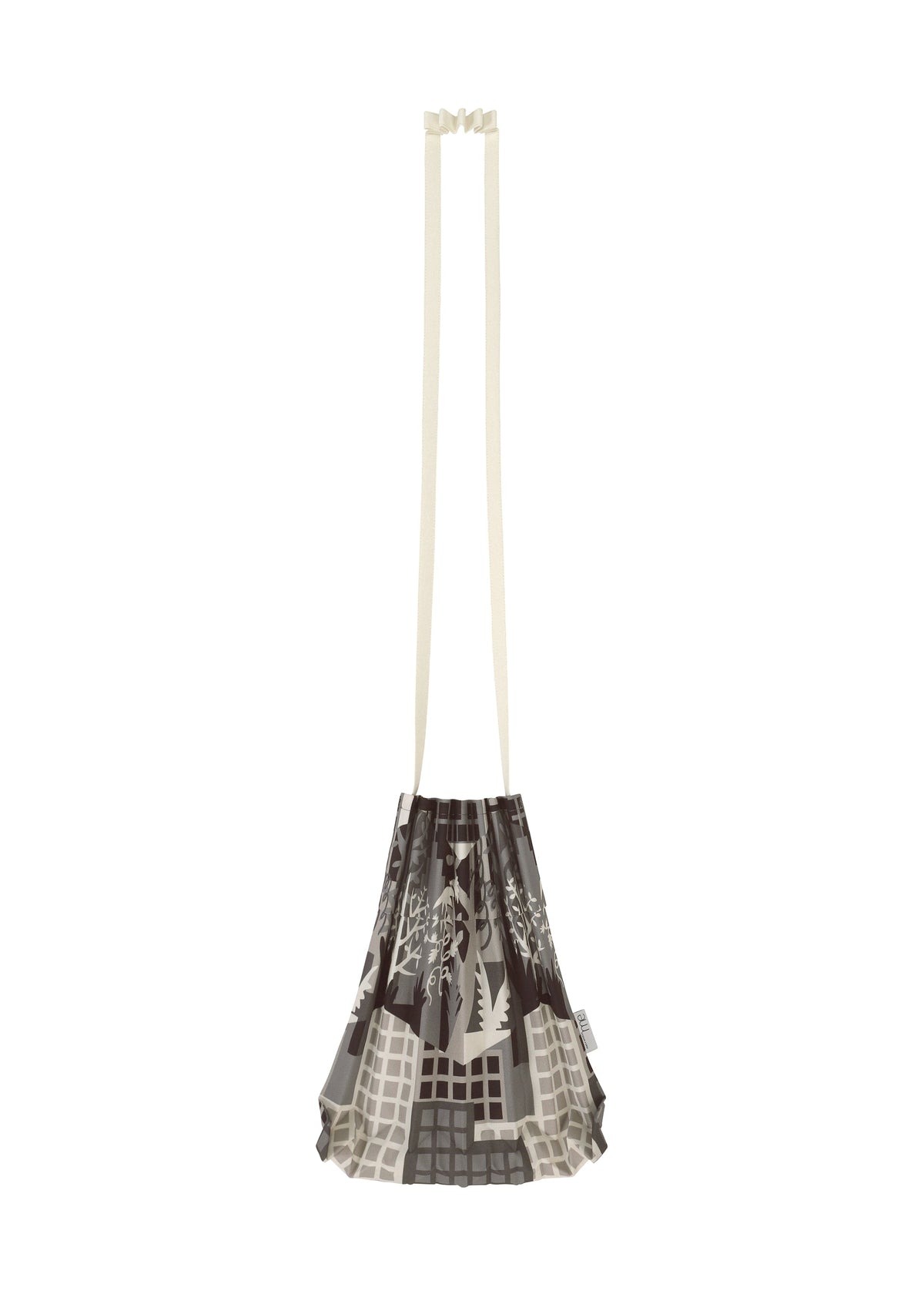 The BUILDING TRUNK PLEATS BAG by me ISSEY MIYAKE is a pleated shoulder bag featuring brown and gray patterns, a distinctive handle, and extended cream-colored straps, showcased against a white background. view 5 of 8