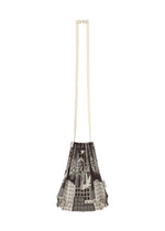 The BUILDING TRUNK PLEATS BAG by me ISSEY MIYAKE is a pleated shoulder bag featuring brown and gray patterns, a distinctive handle, and extended cream-colored straps, showcased against a white background.