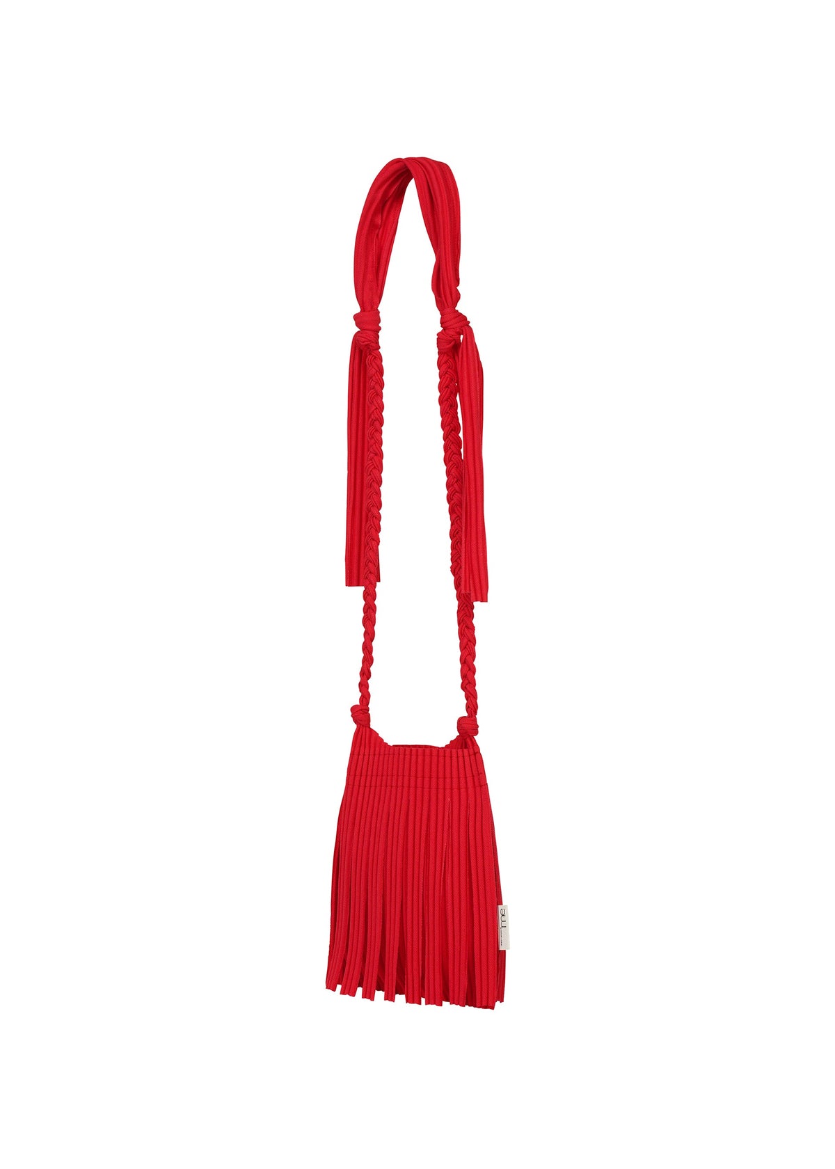 The LEAF PLEATS BAG by me ISSEY MIYAKE is a compact, vibrant red handbag featuring a pleated design and an elongated, knotted strap, styled in the manner of a chic jersey shoulder bag and showcased against a plain white background. view 4 of 6