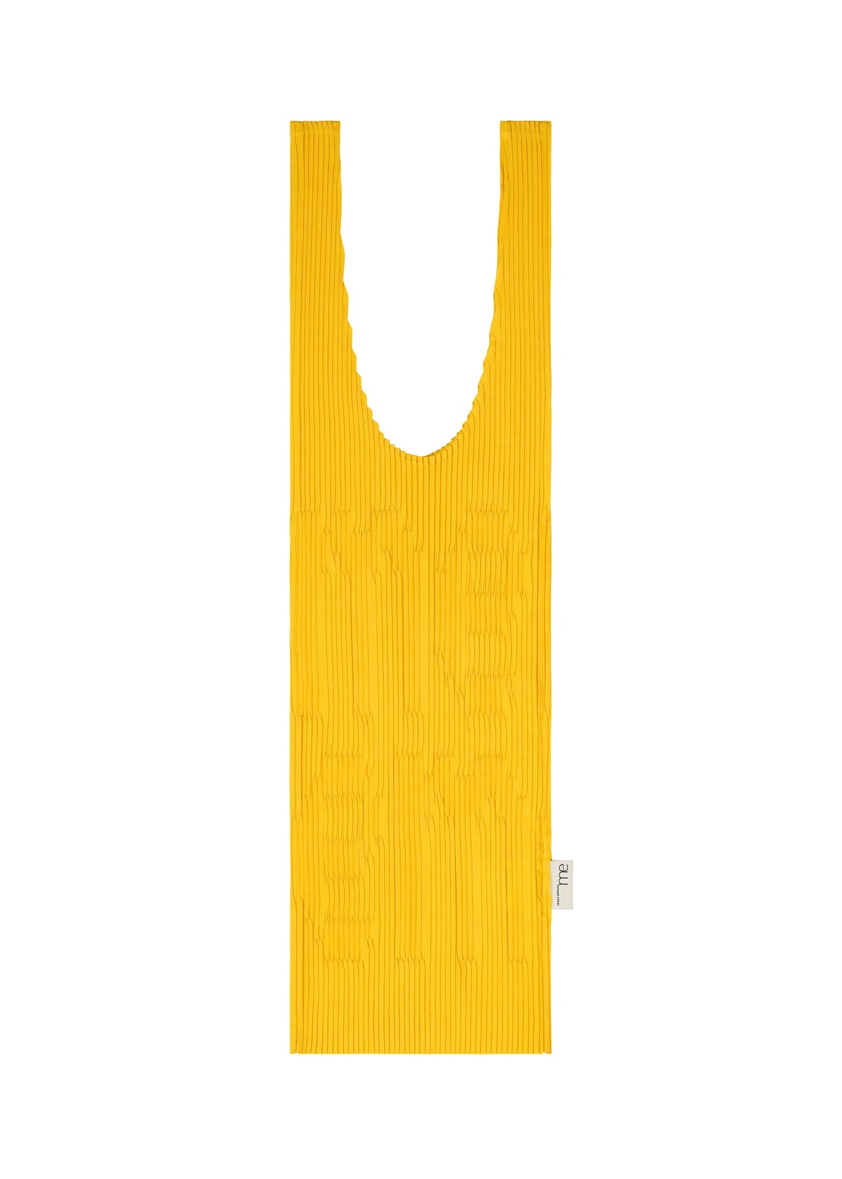 The LOGO PLEATS BAG by me ISSEY MIYAKE, a flat yellow pleated bag with wide handles and a white tag, stands out against a white background, highlighting its unique texture and reusable design. view 3 of 6
