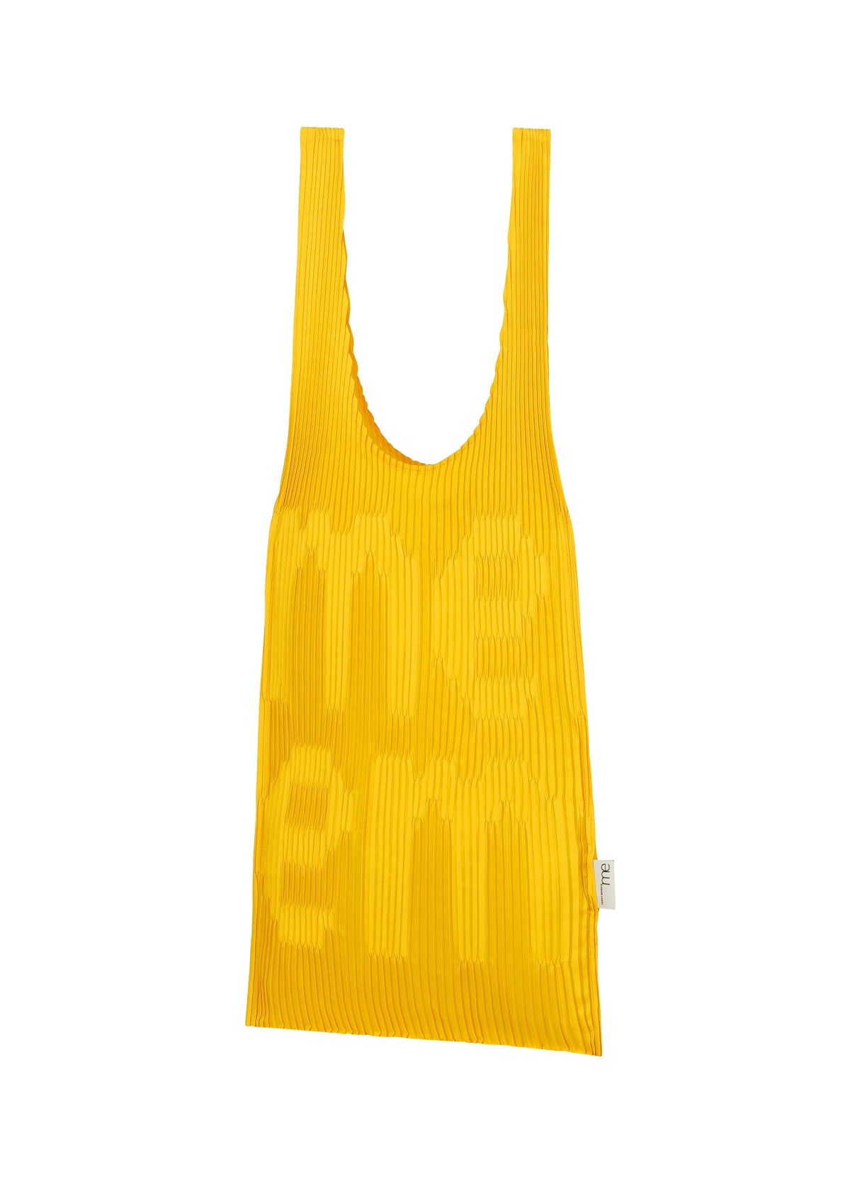 Zoomed view A yellow LOGO PLEATS BAG by me ISSEY MIYAKE with wide handles, textured ridges, subtle raised MEME branding on the front, and a small white tag on the right side. Crafted with a pleating machine.