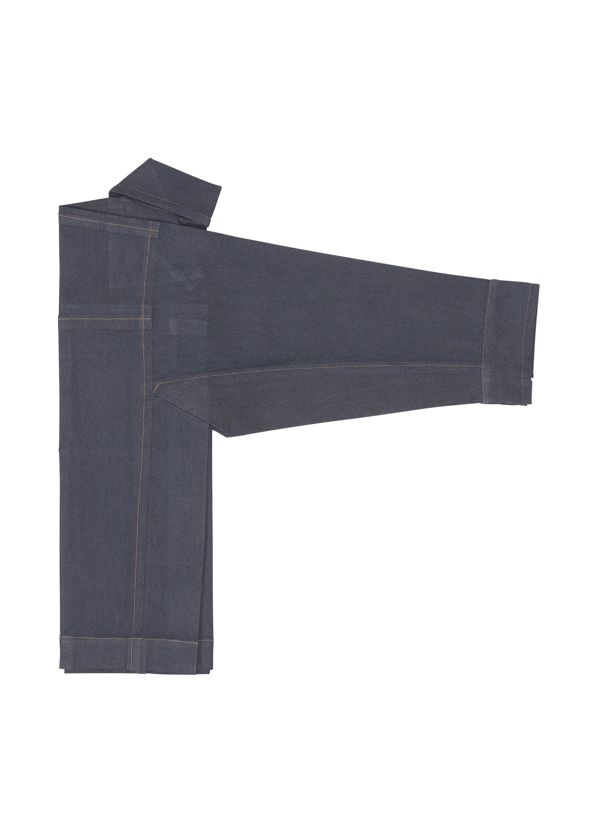 Zoomed view The FLAT DENIM jeans by me ISSEY MIYAKE, made from dark blue recycled polyester denim, are folded with one leg extended and the waistband at the top left, highlighting their realistic denim texture.