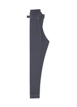 The FLAT DENIM by me ISSEY MIYAKE, shown folded on a white background, features dark blue denim with visible stitching and classic pockets for a timeless style.