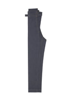 The FLAT DENIM wide pants by me ISSEY MIYAKE, made from dark blue recycled polyester denim, are neatly folded in half and displayed on a plain white background, highlighting their realistic denim texture.